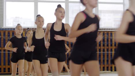 girls warming up for pe lesson