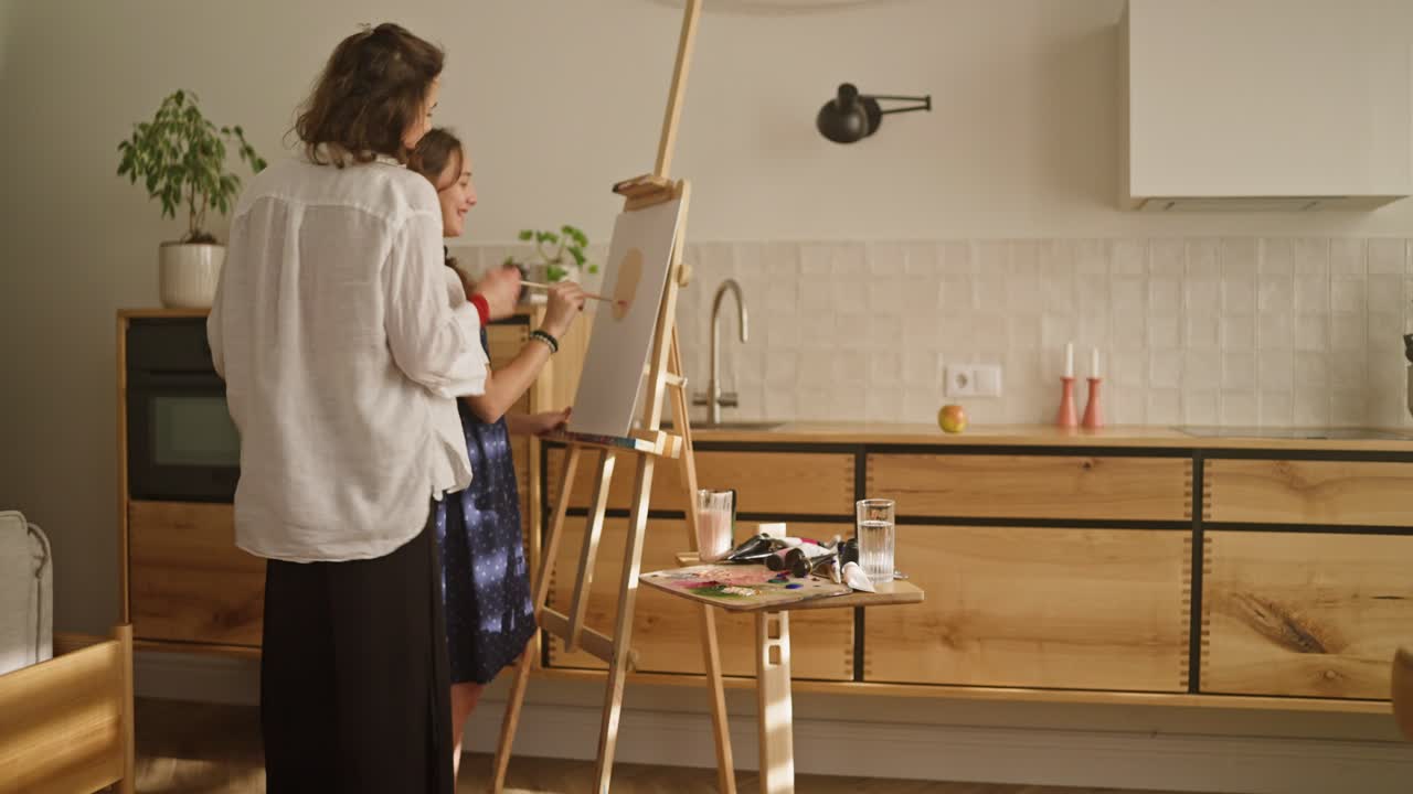 Mother and Daughter Painting Together at Home