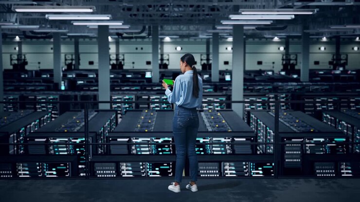 Woman Monitoring Server Room