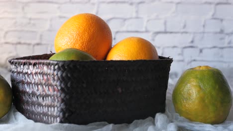 oranges and mandarins in a woven basket