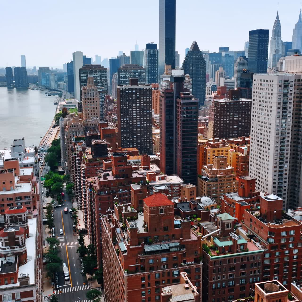 Part of New York above the beautiful Hudson River. Multistoried buildings at backdrop of skyscrapers. Top view