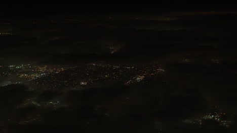 flying over los angeles on an overcast night