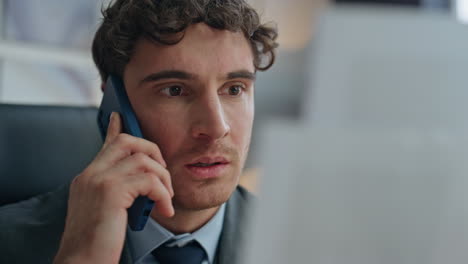 worried businessman speaking phone checking papers at office closeup. mad guy