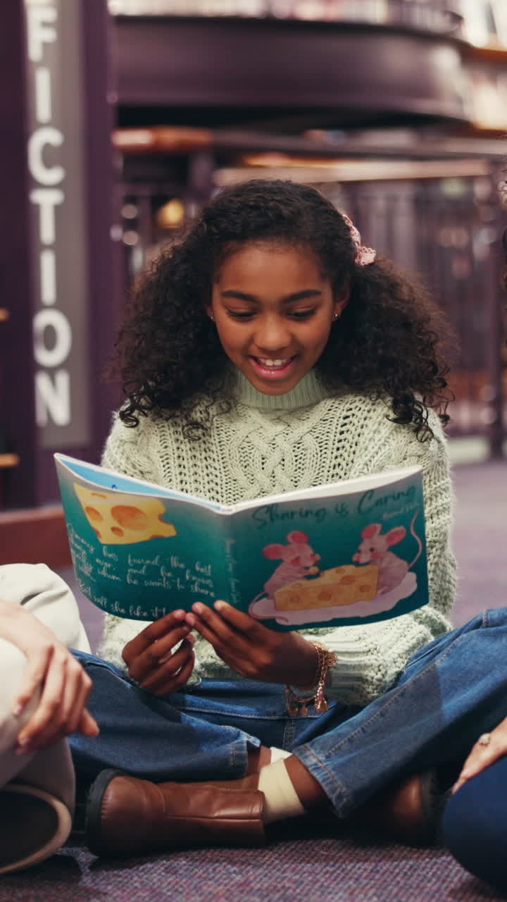 Young Girl Reading a Storybook in a Library