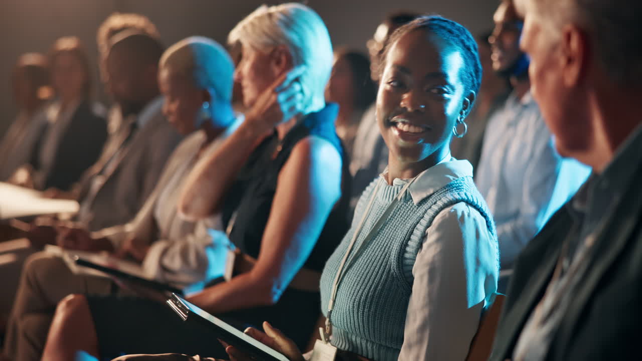 Smiling Woman Listening at a Business Conference Event