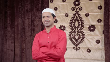 happy confident indian muslim man standing crossed hands