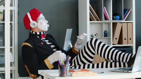 mime performing in an office