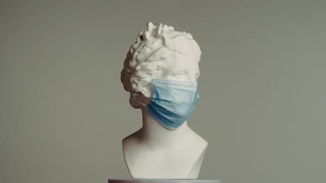 ancient bust with face mask