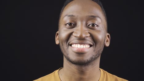 close-up portrait of smiling friendly african young man.