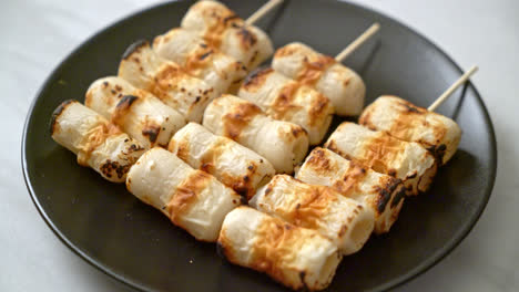 grilled tube shaped fish paste cake or tube squid skewer