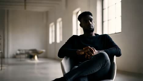 man sitting in modern interior