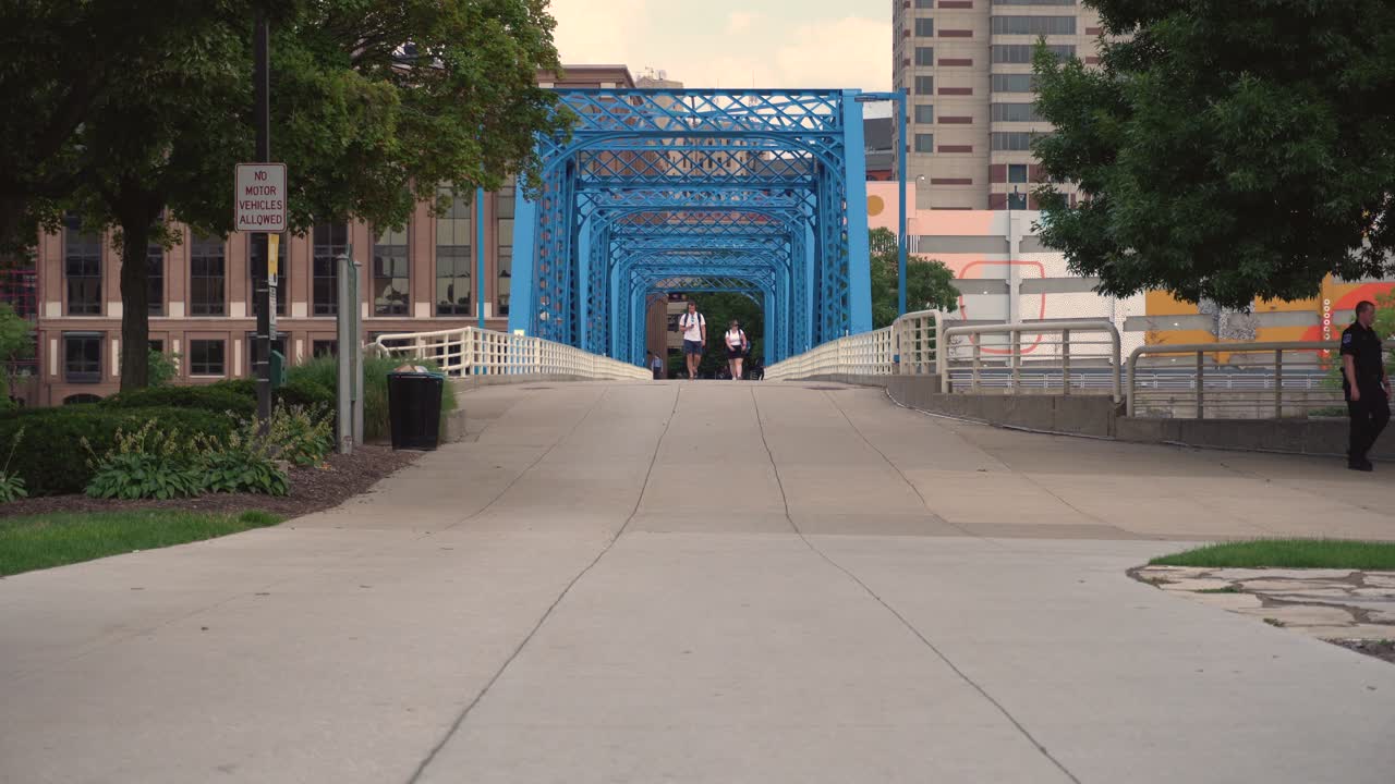 Long shot of the famous Blue Bridge in Grand Rapids, Michigan. 30 seconds, 24fps, 4k. Color Corrected and color graded warm.