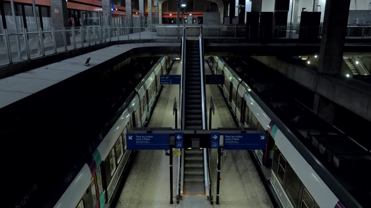 Empty subway station and moving escalator in Paris, France