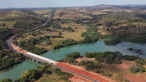 Aerial-view-of-bridge-in-duplication-phase-on-highway,-land-transport,-vehicles,-trucks