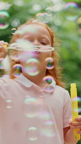 child blowing bubbles