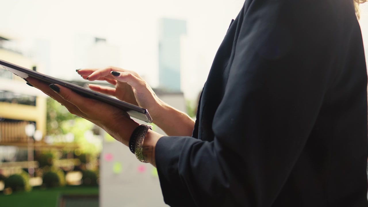 Businesswoman Using Digital Tablet in Outdoor Office Setting