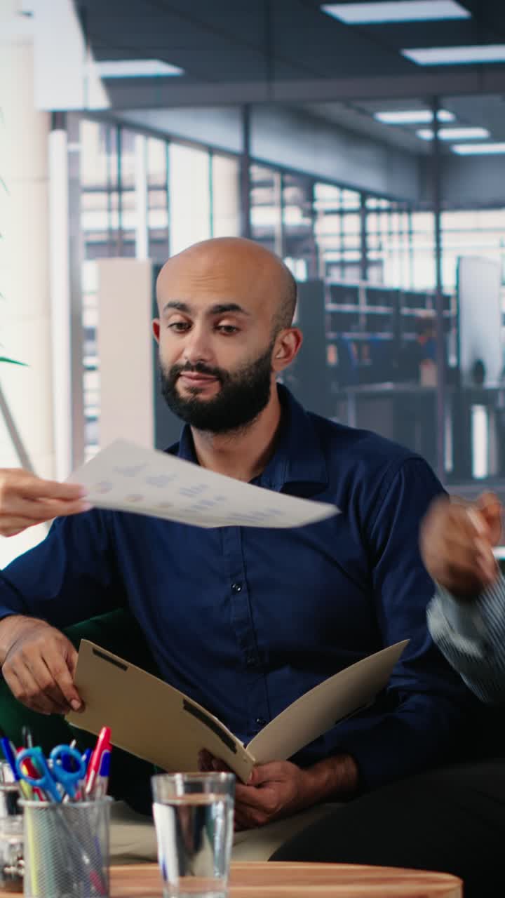 Vertical Video Multiethnic leaders meeting in office to establish financial forecasting