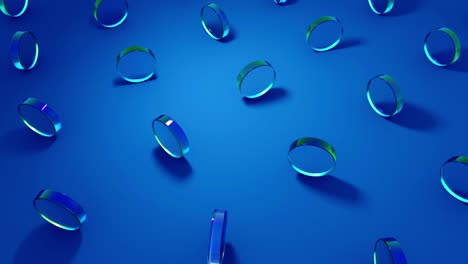 renderización por computadora en 3d de objetos redondos de vidrio de cristal que giran sobre un fondo azul.