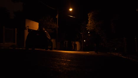 healthy males shadow running down dark street at night exercise activity