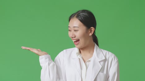 woman in lab coat presenting