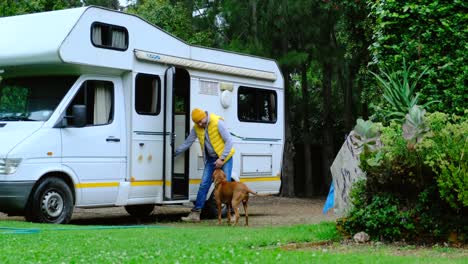 travel man preparing to travel by caravan car with his beloved dog, canada