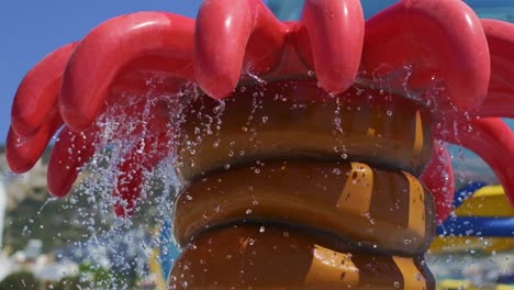 the water pouring from the tree figure in the aqua park