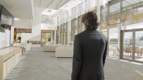 business man leaving modern office