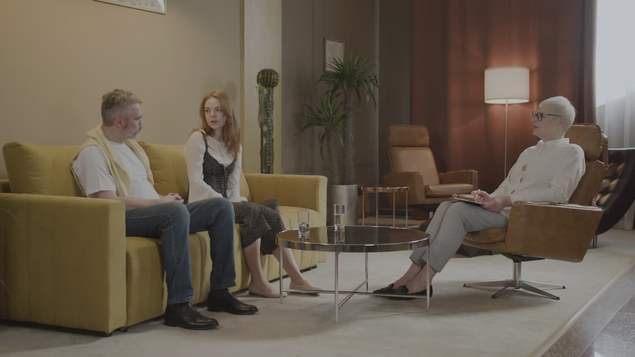 Man and woman visiting psychologist.