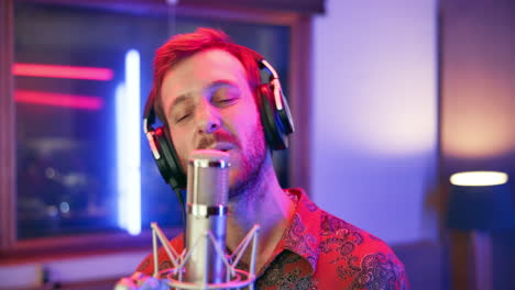 man recording music in studio
