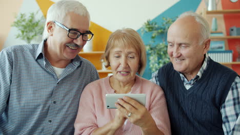 senior friends enjoying a smartphone interaction