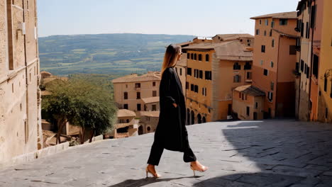woman walking on a cobblestone street in a historic european town