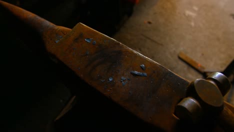 hammer tool on anvil in workshop 4k