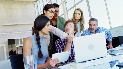 Business-executives-discussing-over-laptop-4k