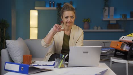 home office worker woman making negative gesture at camera.