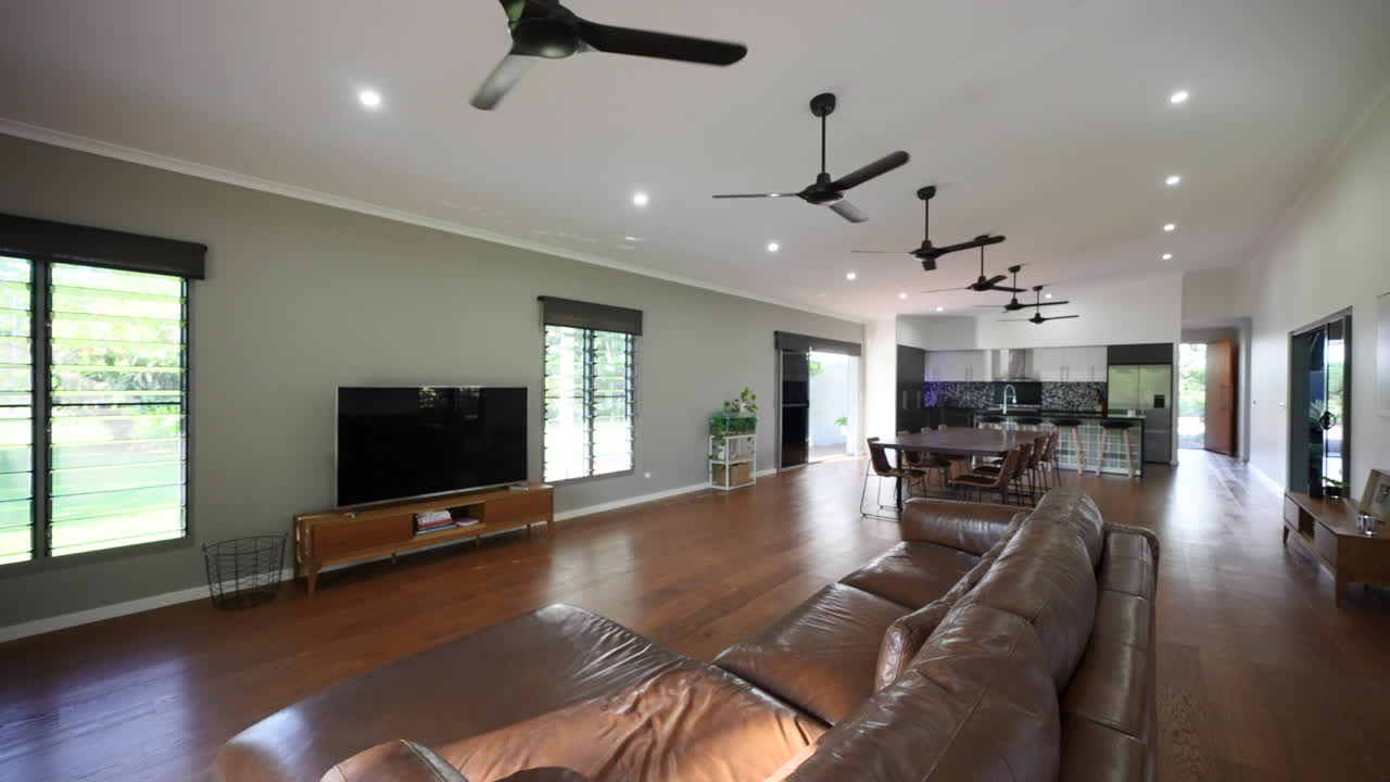 Luxury lived in home with large loungeroom and open air kitchen, row of ceiling fans circulate cool air