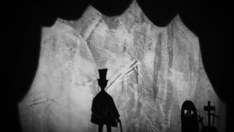 shadow puppet show of a man and ghost