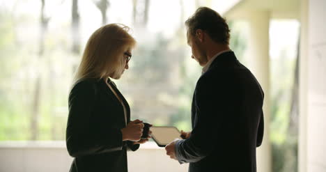 Extreme-Close-Up-Of-Business-Woman-Using-Tablet-Computer-On-A-Meeting-5