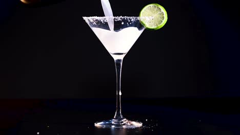 pouring and serving a classic margarita cocktail