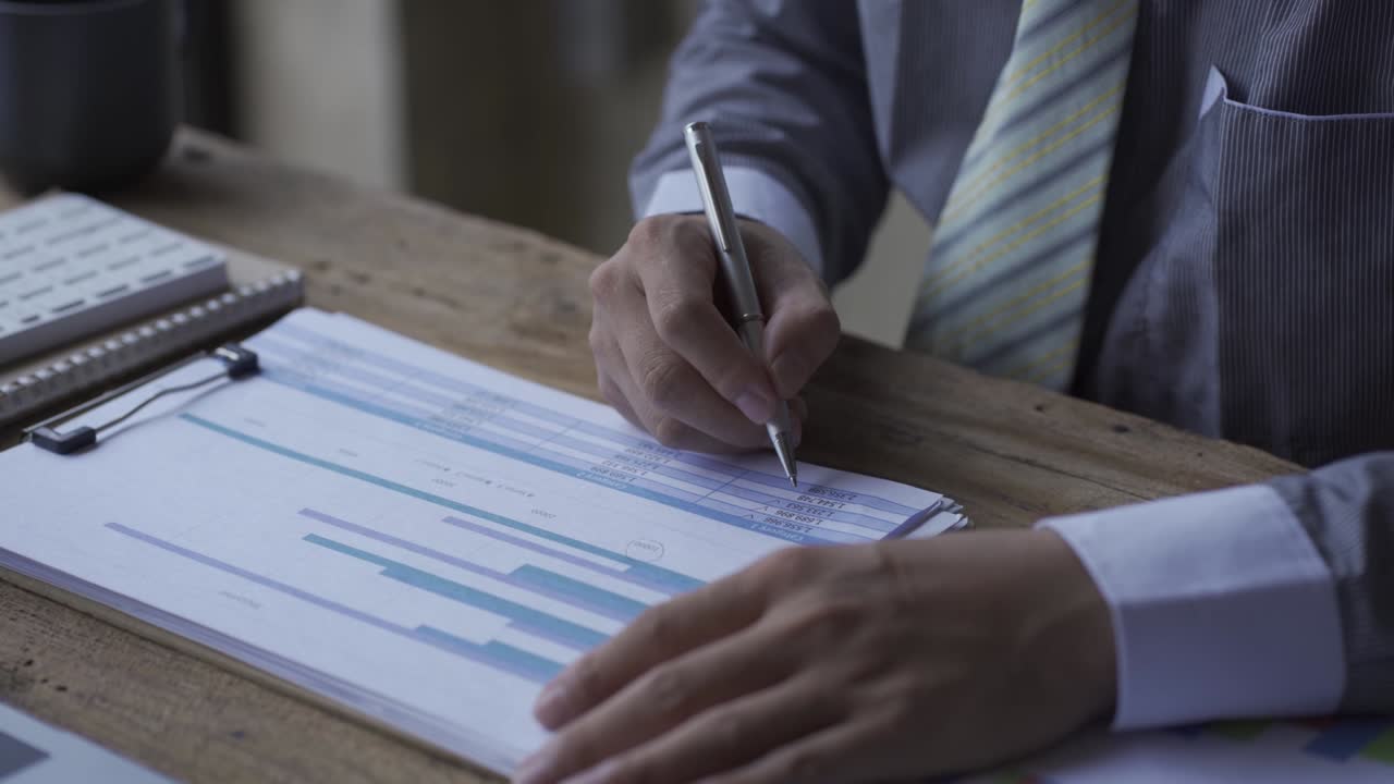 Business people develop business projects and analyze market data working in the office with business reports and stock analysis documents. paperwork concept