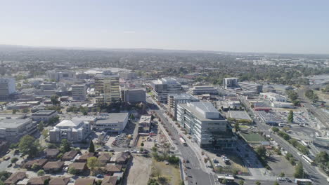 dandenong city from aerial perspective with many public buses moving through the main streets below