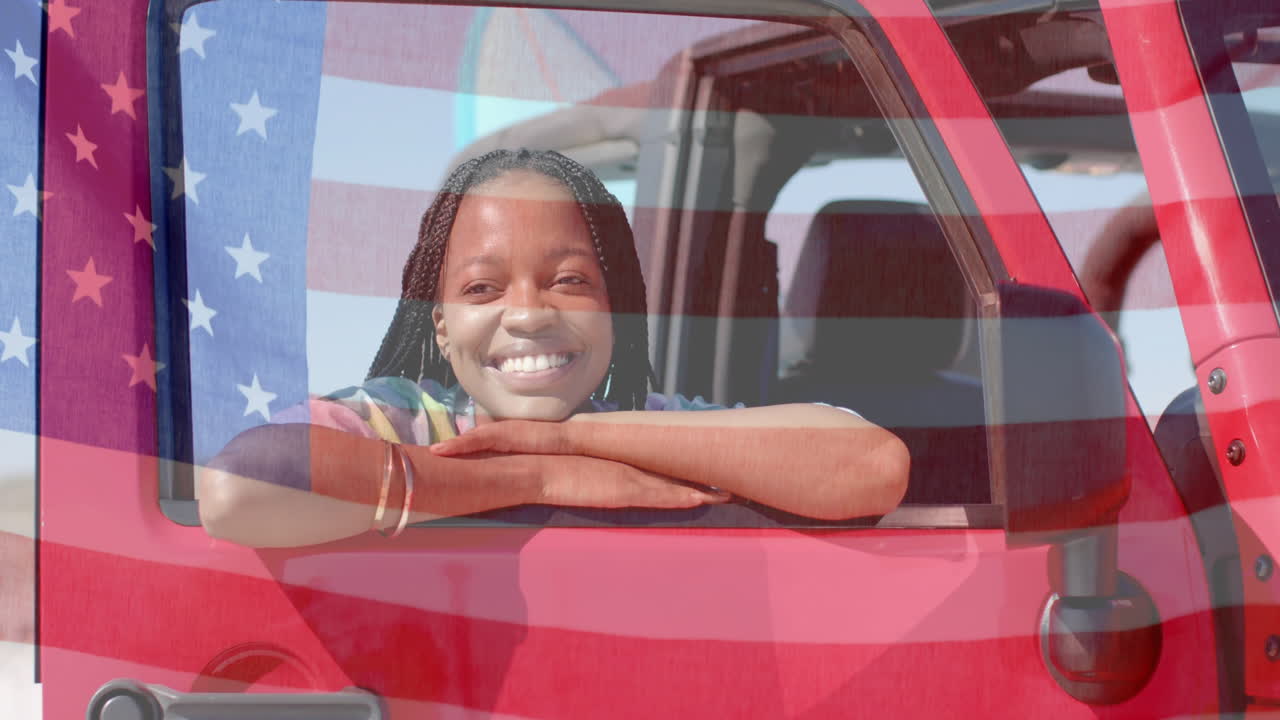 animación de la bandera de los ee.uu. sobre feliz mujer afroamericana en coche por la playa