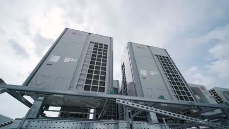 the air conditioning and ventilation system of a large industrial facility is located on the roof. it includes an air conditioner, smoke exhaust, and ventilation.