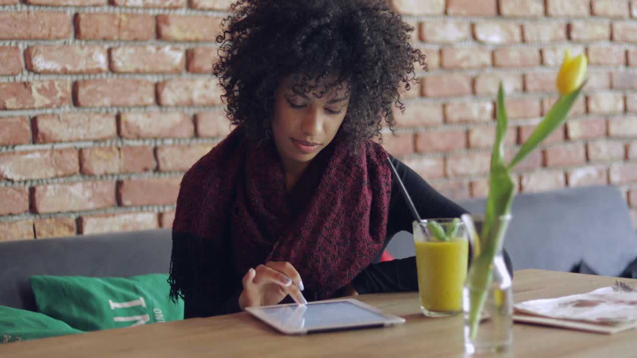 Woman using table in cafe
