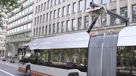 electric bus charging in the city - public transport, medium shot