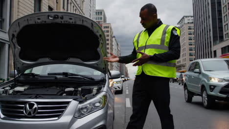 security guard assisting a broken-down car