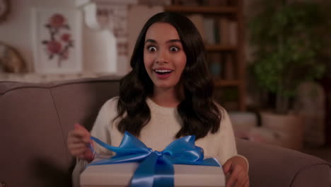 excited woman opening a gift box