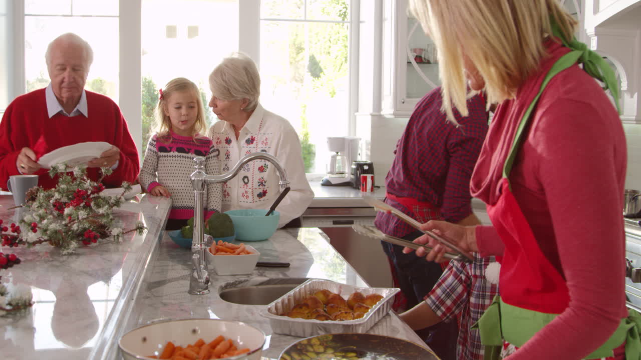 Family With Grandparents Prepare Christmas Meal Shot On R3D