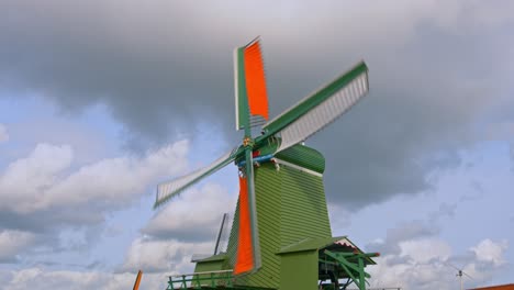 timelapse of spinning windmills under cloudy sky in amsterdam, netherlands