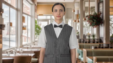 indian woman waiter looking at someone