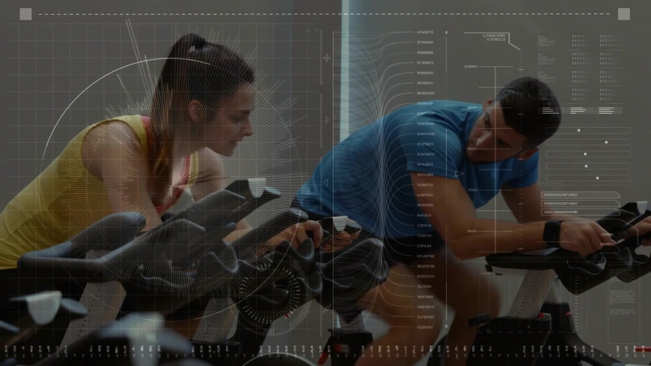Vertical video: Cycling woman in yellow top and partner starting on bikes at gym, checking console